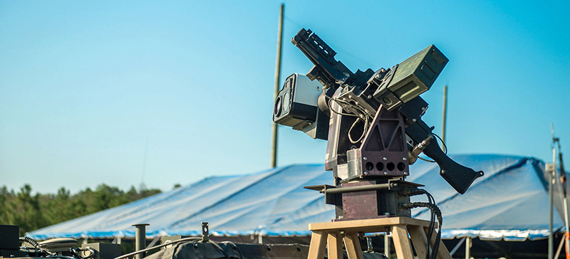 The ARES optical system, developed by the NSWCDD, is mounted on ARDEC’s Picatinny Lightweight Remote Weapon System and coupled with an M240B crew-served weapon. These are two of three subsystems that make up the Wingman. (U.S. Army photo by Keith Briggs, TARDEC Ground Vehicle Robotics)