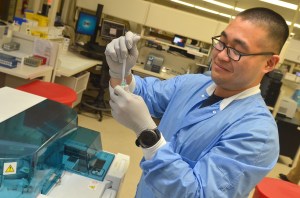 JACKSONVILLE, Fla. (April 23, 2018) Hospitalman Joseph Kim, a native of Dallas, Texas, draws serum into a cuvette at Naval Hospital Jacksonville’s laboratory. “We do something different every day. It’s exciting, makes you feel like a scientist; we understand the importance the laboratory plays in medical readiness.” Medical Laboratory Professionals Week, April 22- 28, is a celebration of medical laboratory professionals and pathologists who play a vital role in health care and patient advocacy. (U.S. Navy photo by Jacob Sippel, Naval Hospital Jacksonville/Released).